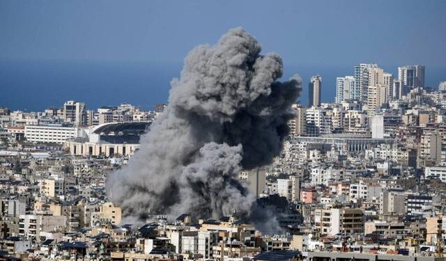 An explosion from an Israeli airstrike on a building sends thick smoke into the sky in Dahiyeh southern Beirut AP pic