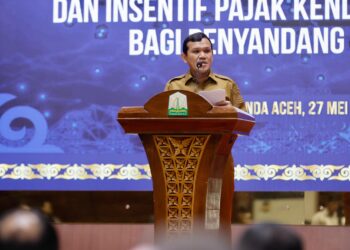 Wakil Gubernur Aceh Fadlullah Memberi Sambutan pada Acara Peluncuran Inovasi Layanan Kesamsatan Aceh dan Pemberian Insentif Pajak bagi Penyandang Disabilitas, Selasa 27/5/2025 di Anjong Mon mata