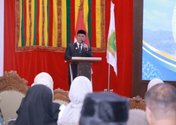 Bupati Aceh Besar H. Muharram Idris menyampaikan sambutan dan arahan pada Pengukuhan LKKS Kabupaten Aceh Besar Masa Bakti 2025–2030 di Meuligoe Bupati Aceh Besar, Kota Jantho, Rabu (16/9/2026). FOTO/ MC ACEH BESAR